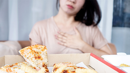 Woman holding her chest